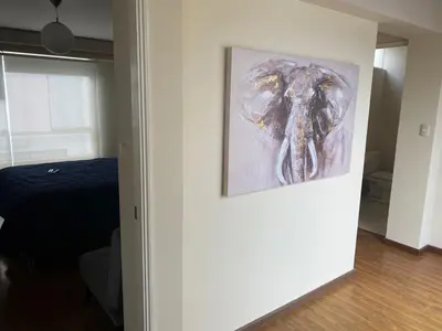 a painting of an elephant hanging on a wall at Miraflores - Luxury Room in the Best Place in Lima