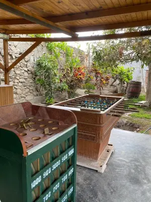 a ping pong table sitting under a pergola at Las Cabañas de Incahuasi in Lunahuaná