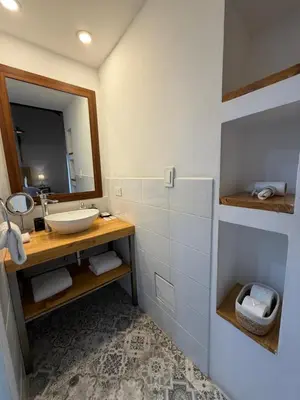 a bathroom with a sink and a mirror at CASA CRISTOBAL Siete Cuartones in Cusco