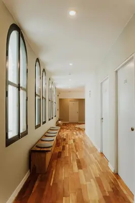 a hallway with a row of mirrors on the wall at Kokoa Hotel Cusco in Cusco