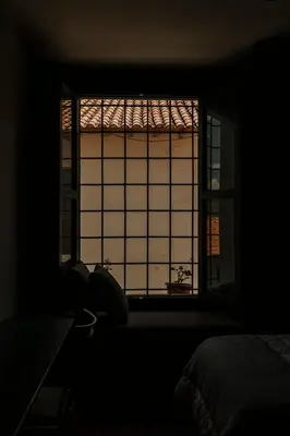 a window in a dark room with a view of a room at Kokoa Hotel Cusco in Cusco