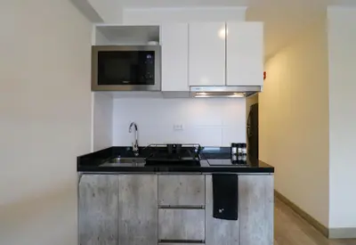 a kitchen with a sink and a stove at Grau by Wynwood House in Lima