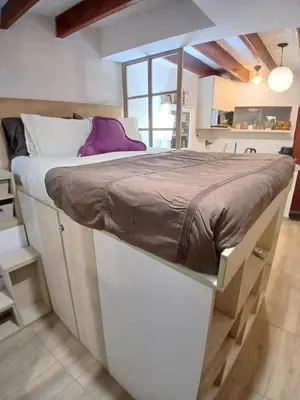 a large white bed in a room with a window at Central, cozy & self-contained petfriendly apartments in the heart of Miraflores in Lima