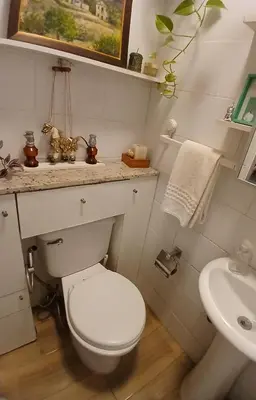 a bathroom with a white toilet and a sink at Central, cozy & self-contained petfriendly apartments in the heart of Miraflores in Lima