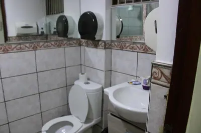 a bathroom with a toilet and a sink at Hospedaje San Isidro 402 in Lima
