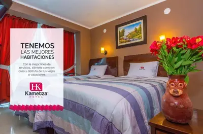 a hotel room with a bed with a sign on it at Kametza Hotel Ayacucho in Ayacucho
