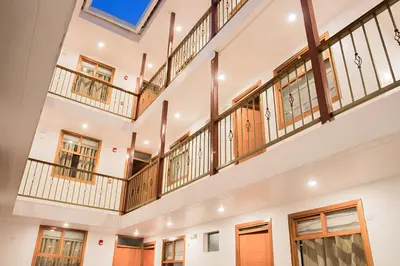 an image of a large building with balconies at Estancia San Pedro Hotel in Cusco