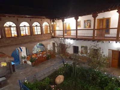 an old building with a courtyard with a lot of windows at Terra Sagrada Cusco in Cusco
