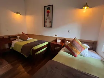 a hotel room with two beds in a room at Terra Sagrada Cusco in Cusco