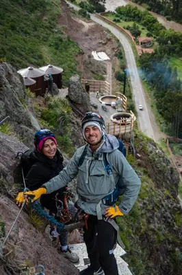 a couple of people standing on a mountain at Starlodge Adventure Suites in Urubamba