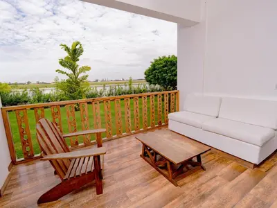 a living room with a couch and a coffee table on a balcony at Hotel Viñas Queirolo in Ica