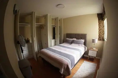 a bedroom with a large bed and a window at Apartamento 3 Habitaciones Lima, Perú (Magdalena del Mar) in Lima