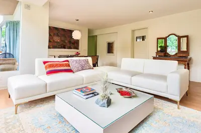 a living room with a white couch and a coffee table at ✶ Kotosh Residence ✶ LUXURY Best Location & Piano in Lima