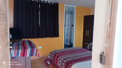 a bedroom with a bed and a window at Nature Home Cusco in Cusco