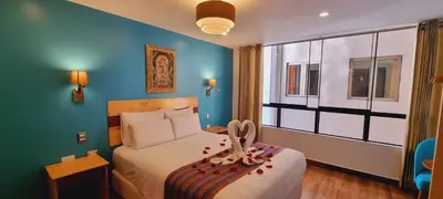 a hotel room with a bed and a window at HOTEL LUZ GARDEN in Machu Picchu