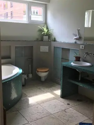 a bathroom with a tub and a toilet and a sink at Loft grande cerca al Olivar en San isidro-Lima in Lima
