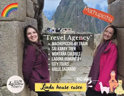 two women standing next to a wall with a rainbow at linda house cusco in Cusco