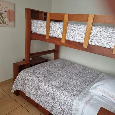 a bunk bed in a room with a bed gmaxwell gmaxwell gmaxwell at Apart Hotel Doña Esther in Lima