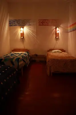 a room with two beds in a tent at Tiyana House in Cusco