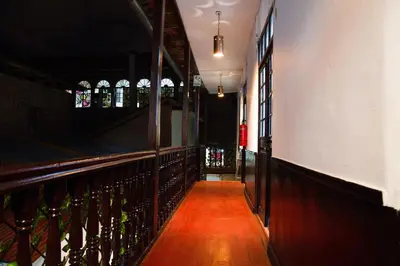 a hallway in a bar with bottles of alcohol at Tiyana House in Cusco