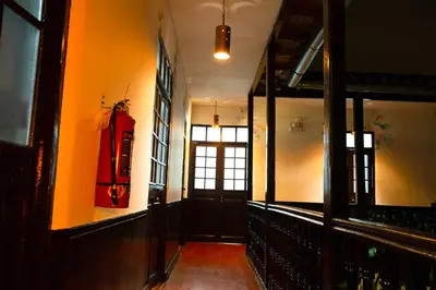a hallway with a door and a window in a building at Tiyana House in Cusco