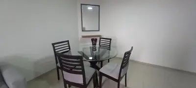 a glass dining room table with four chairs and a mirror at Dpt suite pardo 610 in Lima
