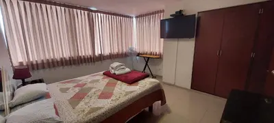 a bedroom with a bed with a quilt on it at Dpt suite pardo 610 in Lima