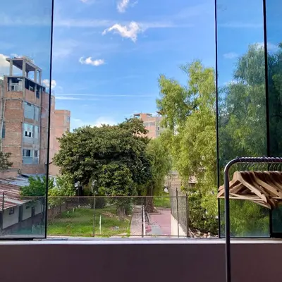 a window with a view of a park at Departamento céntrico con terraza ideal para grupos in Ayacucho