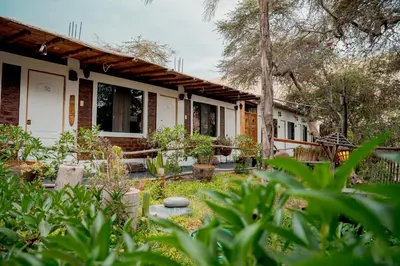a house with a garden in front of it at Rochabus in Ica