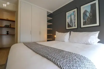 a bedroom with a large white bed in a room at El Sol by Wynwood House in Lima