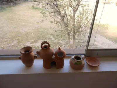 a group of clay pots sitting on a window sill at Ayllu B&B Ollantaytambo in Ollantaytambo