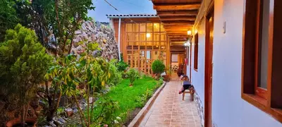 a hallway of a house with a garden at Casa de Ollanta ByB in Ollantaytambo