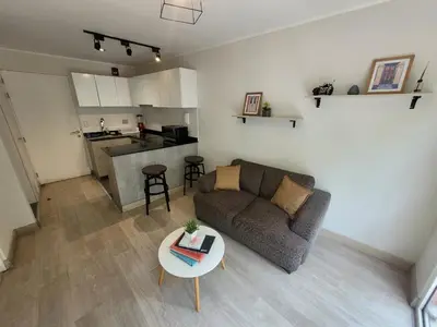a living room with a couch and a table at Espacio Luxury Apartments - Edificio Pedro de Osma in Lima