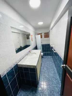 a bathroom with a sink and a mirror at Rainbow Hostel in Lima