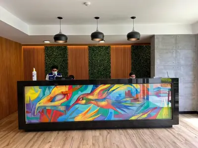 a large colorful painting on a tv in a lobby at BARRANCO Apartment Lima Peru in Lima