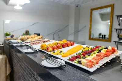 a buffet line with many different types of fruits and vegetables at Casona Plaza Hotel Cusco in Cusco