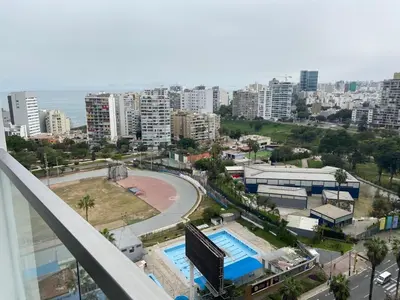 a view of a city from a balcony at Chic & Ocean View Apartment in Lima