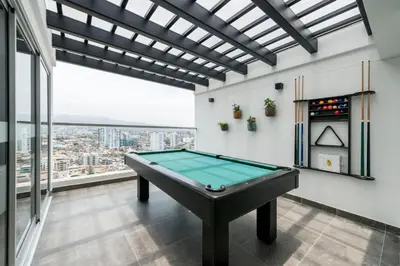 a pool table in a room with a view at Chic & Ocean View Apartment in Lima