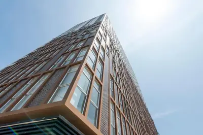 a tall building with windows on the side of it at Chic & Ocean View Apartment in Lima