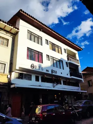 a white building with cars parked in front of it at SQ Estancia Del Inca in Cusco