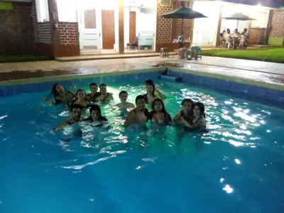 a group of people in a swimming pool at Amachito's Casa Recreacional in Lima