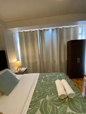 a bedroom with a bed with two towels on it at Casa Yanahuara Valle Sagrado - Urubamba in Urubamba