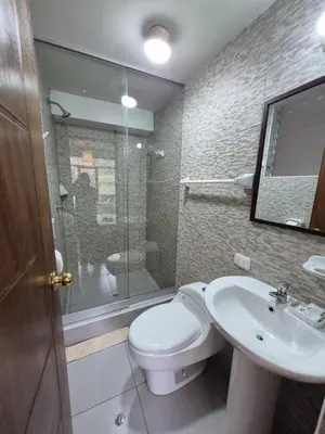 a bathroom with a toilet and a sink and a shower at Casa Yanahuara Valle Sagrado - Urubamba in Urubamba