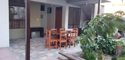 a wooden table and chairs on a patio at Tilcafé B&B Mollepata in Mollepata