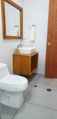 a bathroom with a toilet and a sink and a mirror at Tilcafé B&B Mollepata in Mollepata
