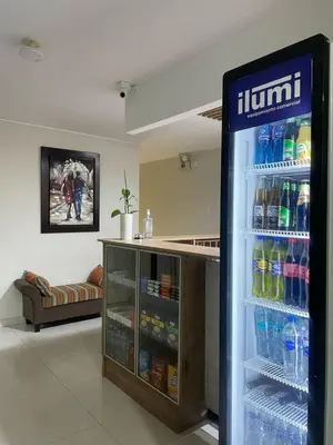 a refrigerator filled with lots of water and drinks at Casa Las Flores Ica in Ica