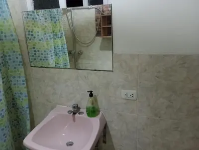 a bathroom with a sink and a mirror at La Quinta Alcanfores in Lima
