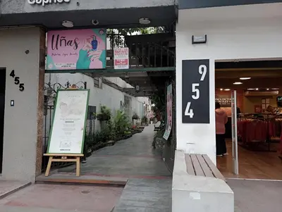 a building with a sign on the side of it at La Quinta Alcanfores in Lima