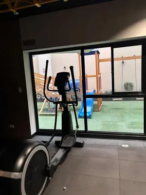 a room with a gym with a treadmill and a playground at Apartamento acogedor en Barranco - cerca a Miraflores in Lima
