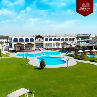 an overhead view of a resort with a large swimming pool at Macacona Hacienda Hotel in Ica